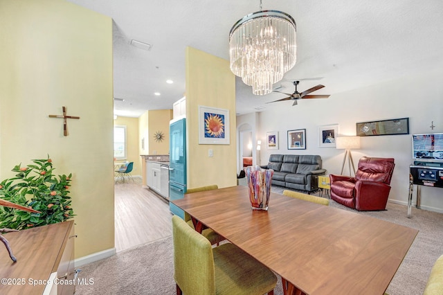 3930 Playa Del Sol Dr Unit 106, Rockledge, FL 32955 - dining area with a chandelier, light colored carpet, and a ceiling fan