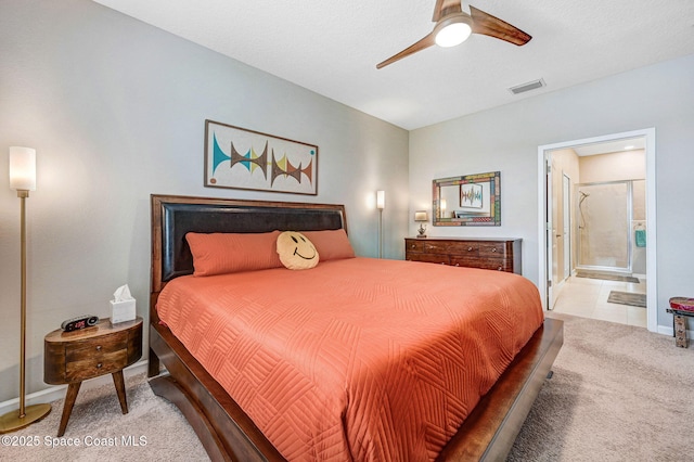 3930 Playa Del Sol Dr Unit 106, Rockledge, FL 32955 - carpeted bedroom with ensuite bath and a ceiling fan
