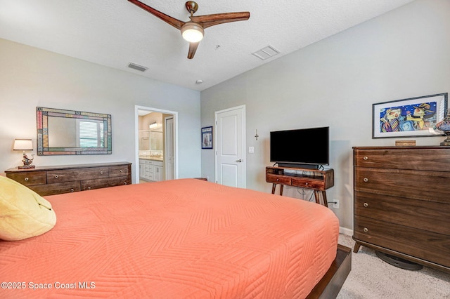 3930 Playa Del Sol Dr Unit 106, Rockledge, FL 32955 - carpeted bedroom with ensuite bath and ceiling fan