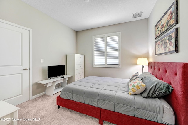 3930 Playa Del Sol Dr Unit 106, Rockledge, FL 32955 - carpeted bedroom featuring baseboards and a textured ceiling