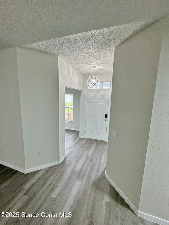 3162 San Salvador Ave, Palm Bay, FL 32909 - hall featuring wood finished floors and a textured ceiling