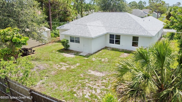 3162 San Salvador Ave, Palm Bay, FL 32909 - rear view of property featuring a shingled roof and stucco siding