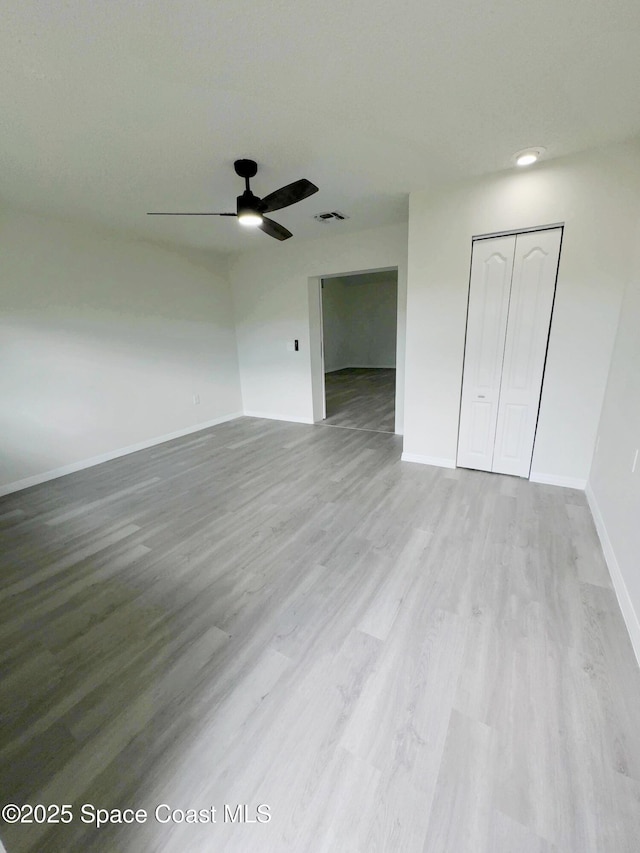 3162 San Salvador Ave, Palm Bay, FL 32909 - unfurnished bedroom featuring a closet, wood finished floors, and ceiling fan