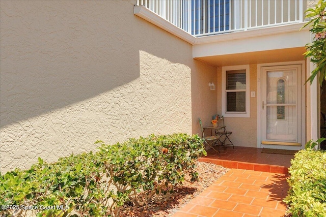 101 La Costa St Unit 2B, Melbourne Beach, FL 32951 - view of exterior entry with stucco siding