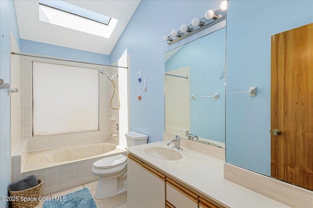 101 La Costa St Unit 2B, Melbourne Beach, FL 32951 - bathroom featuring shower / washtub combination, a skylight, vanity, vaulted ceiling, and tile patterned floors