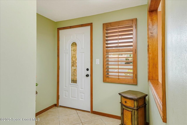 101 La Costa St Unit 2B, Melbourne Beach, FL 32951 - foyer featuring baseboards and light tile patterned floors