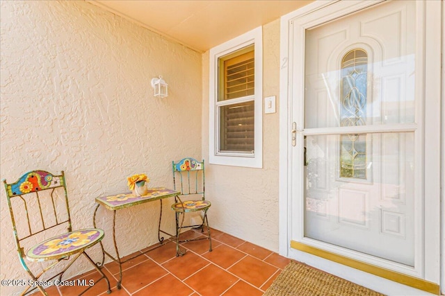 101 La Costa St Unit 2B, Melbourne Beach, FL 32951 - view of exterior entry featuring stucco siding