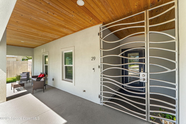 29 Azalea Dr, Cocoa Beach, FL 32931 - property entrance featuring a patio and stucco siding