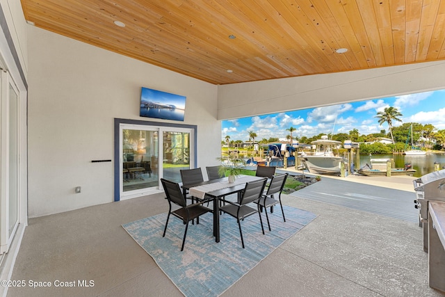 29 Azalea Dr, Cocoa Beach, FL 32931 - view of patio / terrace with outdoor dining area and a dock