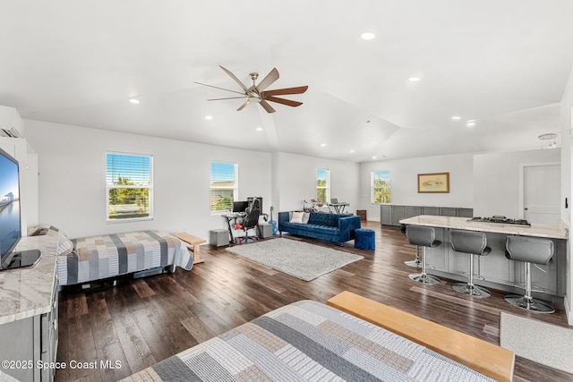 29 Azalea Dr, Cocoa Beach, FL 32931 - living room with ceiling fan, dark wood-style flooring, recessed lighting, and lofted ceiling