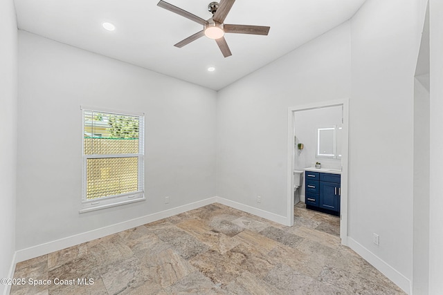 29 Azalea Dr, Cocoa Beach, FL 32931 - empty room featuring stone tile floors, a ceiling fan, vaulted ceiling, and recessed lighting