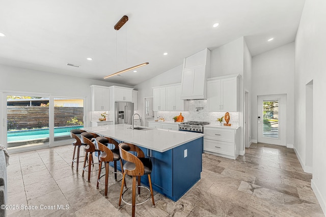 29 Azalea Dr, Cocoa Beach, FL 32931 - kitchen with appliances with stainless steel finishes, tasteful backsplash, white cabinets, light countertops, and recessed lighting