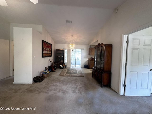 1765 Tatum Blvd, New Smyrna Beach, FL 32168 - living room featuring light colored carpet, a chandelier, and vaulted ceiling