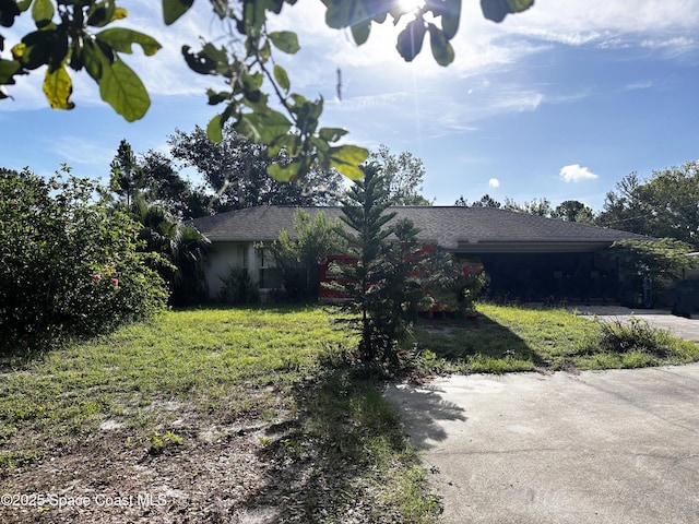 1765 Tatum Blvd, New Smyrna Beach, FL 32168 - view of front of home featuring a front lawn