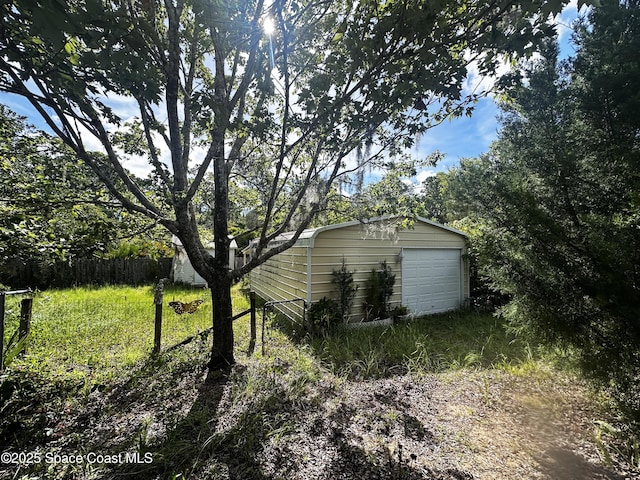 1765 Tatum Blvd, New Smyrna Beach, FL 32168 - view of yard with a garage and an outdoor structure
