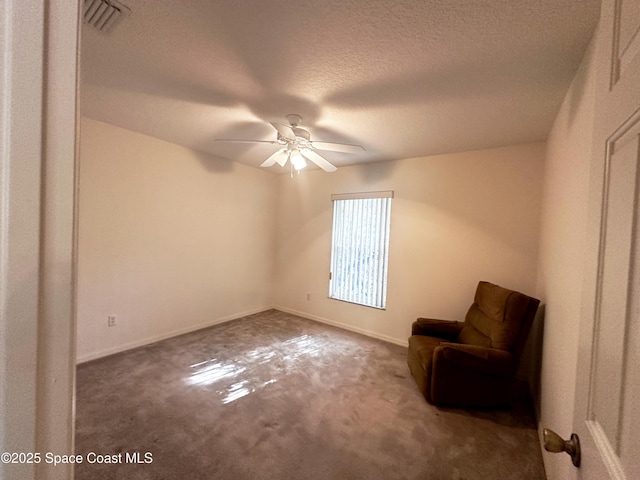 1765 Tatum Blvd, New Smyrna Beach, FL 32168 - unfurnished room featuring carpet floors, a textured ceiling, and ceiling fan