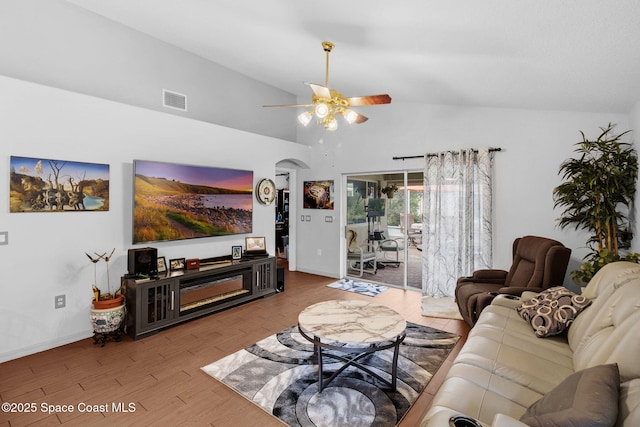 740 Indian Oaks Dr, Melbourne, FL 32901 - living room with ceiling fan, wood finished floors, and high vaulted ceiling
