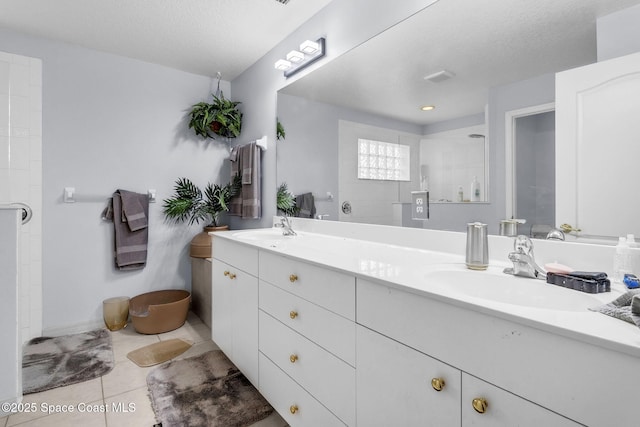 740 Indian Oaks Dr, Melbourne, FL 32901 - full bath with double vanity, tile patterned floors, tiled shower, and a textured ceiling