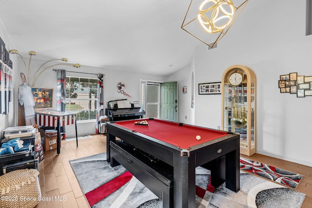 740 Indian Oaks Dr, Melbourne, FL 32901 - rec room featuring pool table, wood finished floors, a chandelier, and vaulted ceiling