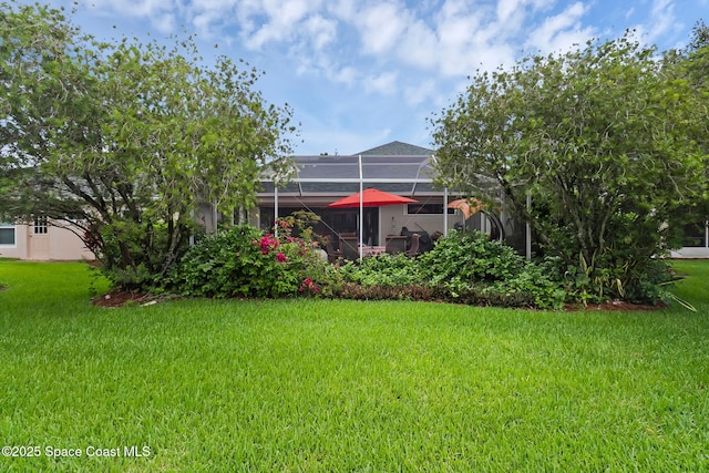740 Indian Oaks Dr, Melbourne, FL 32901 - view of grassy yard with glass enclosure