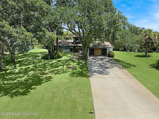 281 Caravan Ter, Sebastian, FL 32958 - obstructed view of property with a front yard and concrete driveway