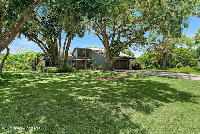 281 Caravan Ter, Sebastian, FL 32958 - view of front facade with concrete driveway, a garage, and a front yard