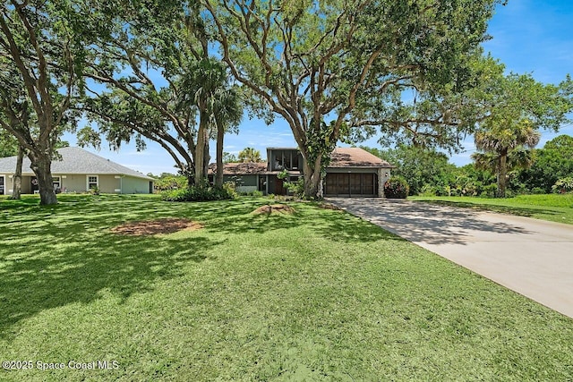 281 Caravan Ter, Sebastian, FL 32958 - view of front of home featuring concrete driveway, a garage, and a front yard