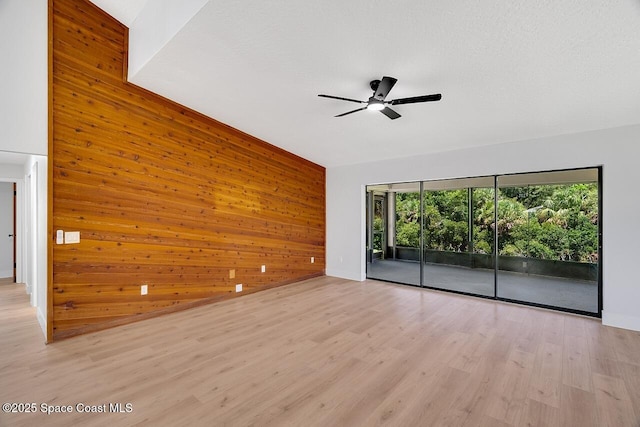 281 Caravan Ter, Sebastian, FL 32958 - spare room with wooden walls, ceiling fan, and light wood-style flooring