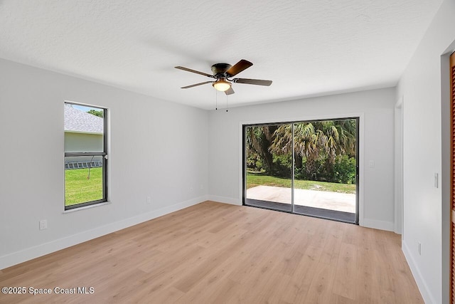 281 Caravan Ter, Sebastian, FL 32958 - unfurnished room with light wood-style flooring, ceiling fan, and a textured ceiling