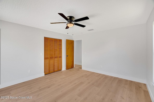 281 Caravan Ter, Sebastian, FL 32958 - unfurnished bedroom with light wood finished floors, a closet, and a ceiling fan
