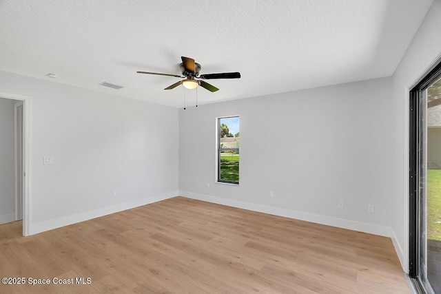 281 Caravan Ter, Sebastian, FL 32958 - spare room with light wood-style flooring, a ceiling fan, and a textured ceiling