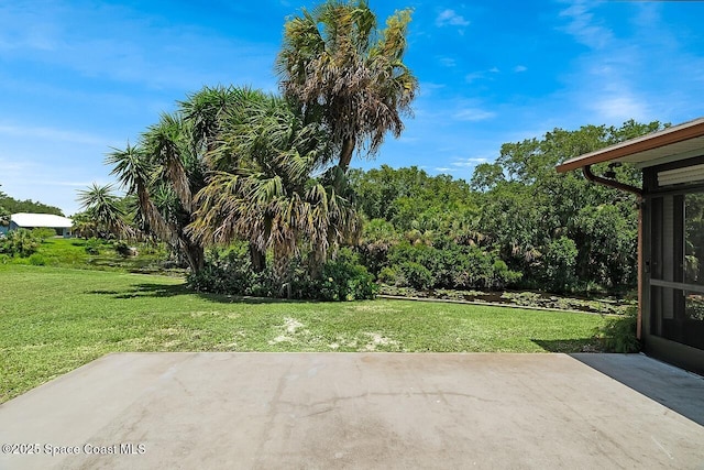 281 Caravan Ter, Sebastian, FL 32958 - view of green lawn featuring a patio area