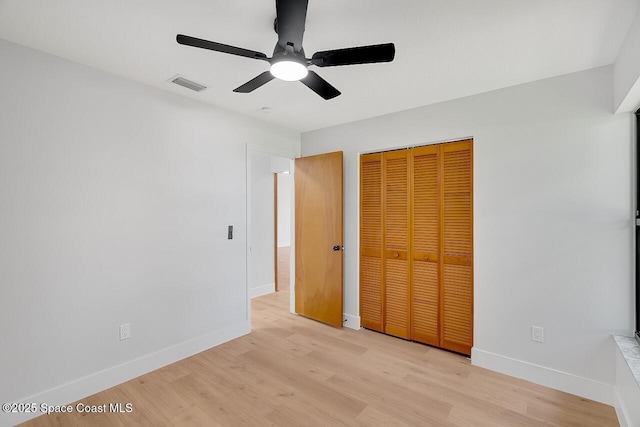 281 Caravan Ter, Sebastian, FL 32958 - unfurnished bedroom with a closet, light wood finished floors, and ceiling fan