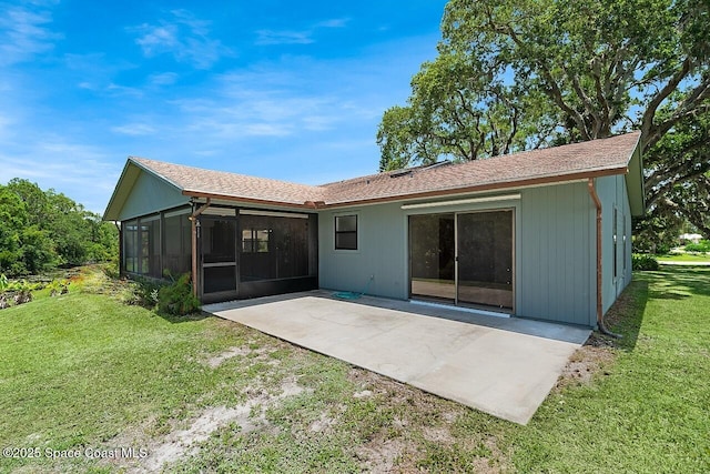 281 Caravan Ter, Sebastian, FL 32958 - back of house with a patio area, a sunroom, a lawn, and a shingled roof