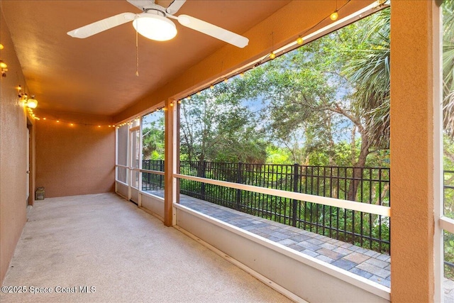 1390 Isabella Dr Unit 106, Melbourne, FL 32935 - unfurnished sunroom with carpet flooring