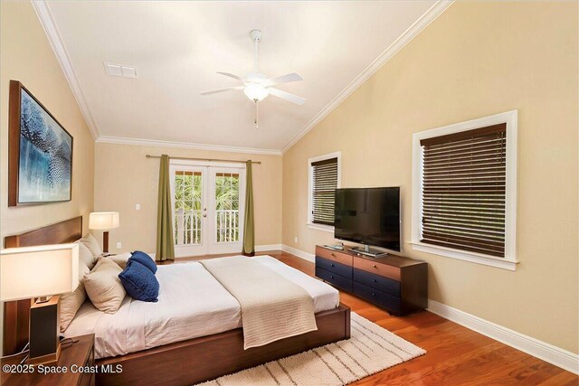 1390 Isabella Dr Unit 106, Melbourne, FL 32935 - bedroom featuring vaulted ceiling, wood finished floors, ornamental molding, access to exterior, and a ceiling fan