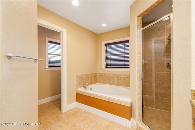 1390 Isabella Dr Unit 106, Melbourne, FL 32935 - full bathroom featuring tile patterned flooring, a bath, a shower stall, and recessed lighting