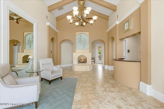 1390 Isabella Dr Unit 106, Melbourne, FL 32935 - living room featuring arched walkways, high vaulted ceiling, a chandelier, beamed ceiling, and ceiling fan