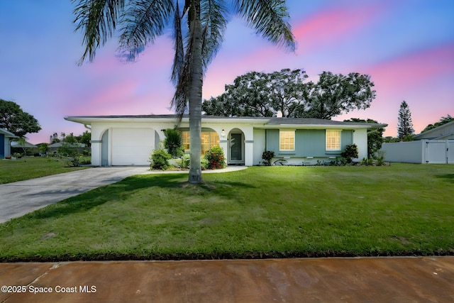 1242 Creel Rd NE, Palm Bay, FL 32905 - ranch-style house featuring an attached garage, concrete driveway, and stucco siding