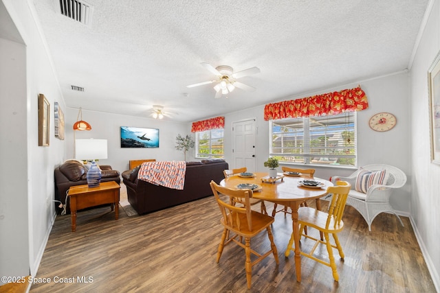 1242 Creel Rd NE, Palm Bay, FL 32905 - dining space featuring wood finished floors, a textured ceiling, and ceiling fan