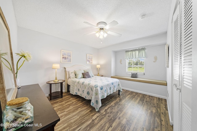 1242 Creel Rd NE, Palm Bay, FL 32905 - bedroom with wood finished floors, a textured ceiling, a closet, and a ceiling fan