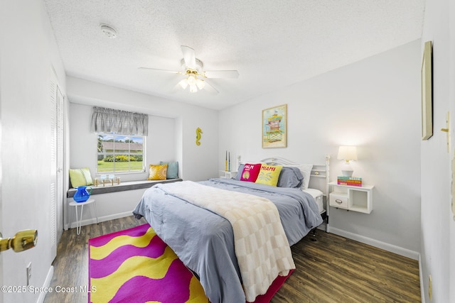 1242 Creel Rd NE, Palm Bay, FL 32905 - bedroom with wood finished floors, a textured ceiling, and ceiling fan