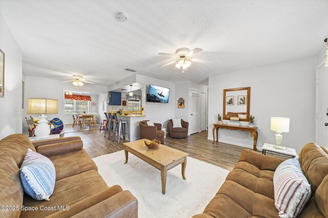 1242 Creel Rd NE, Palm Bay, FL 32905 - living room with ceiling fan and wood finished floors