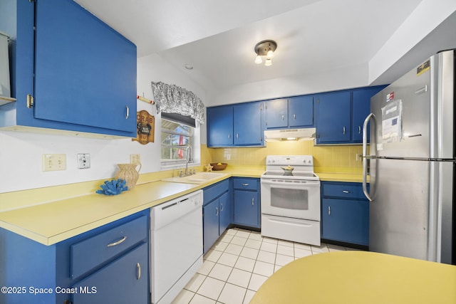 1242 Creel Rd NE, Palm Bay, FL 32905 - kitchen featuring white appliances, under cabinet range hood, blue cabinets, and light tile patterned flooring