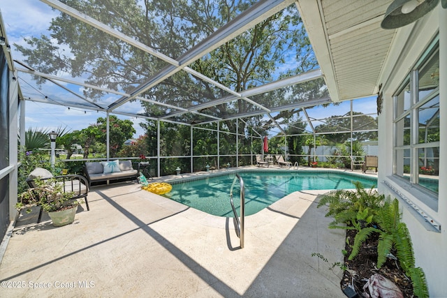 1242 Creel Rd NE, Palm Bay, FL 32905 - swimming pool with a patio area, glass enclosure, outdoor lounge area, and a fenced backyard