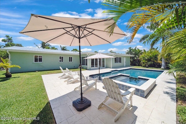 212 Ormond Dr, Indialantic, FL 32903 - view of swimming pool with a patio area, a lawn, and a pool with connected hot tub