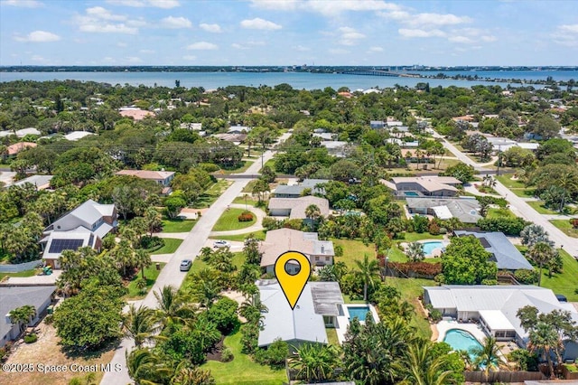 212 Ormond Dr, Indialantic, FL 32903 - aerial perspective of suburban area with a nearby body of water and a notable bridge