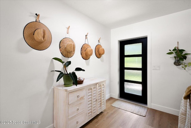 212 Ormond Dr, Indialantic, FL 32903 - entrance foyer featuring light wood-type flooring and baseboards