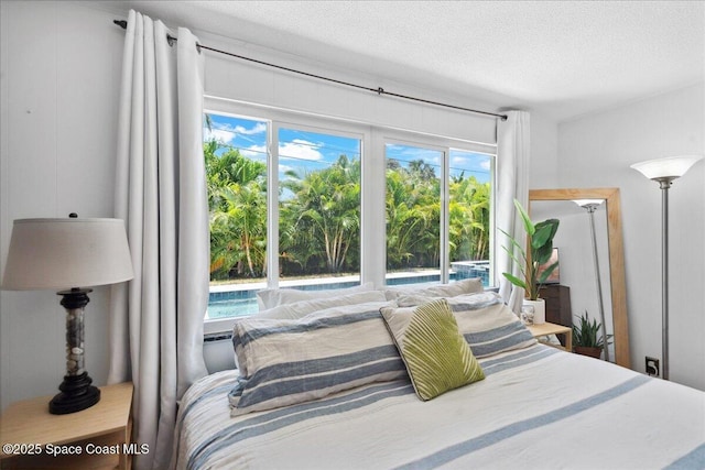 212 Ormond Dr, Indialantic, FL 32903 - bedroom featuring multiple windows and a textured ceiling