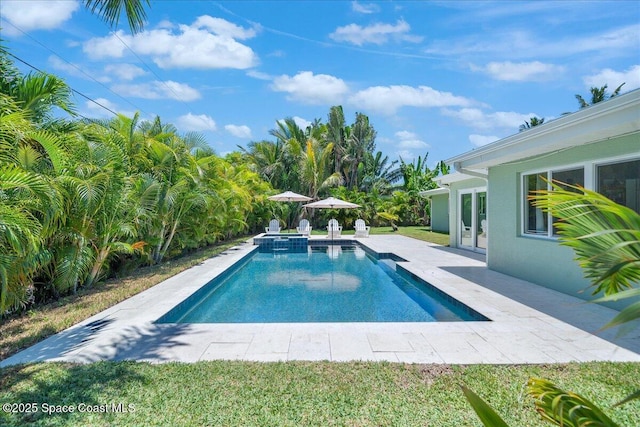212 Ormond Dr, Indialantic, FL 32903 - view of pool featuring a patio and a pool with connected hot tub